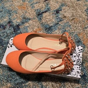 Stylish orange with gold spike flats